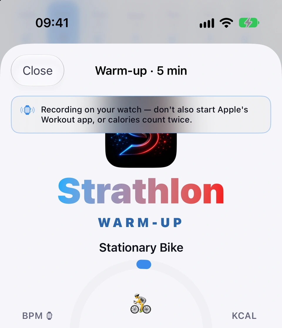 The warm-up starting on a stationary bike with the toast Recording on your watch — don't also start Apple's Workout app, or calories count twice, at the top of the screen.