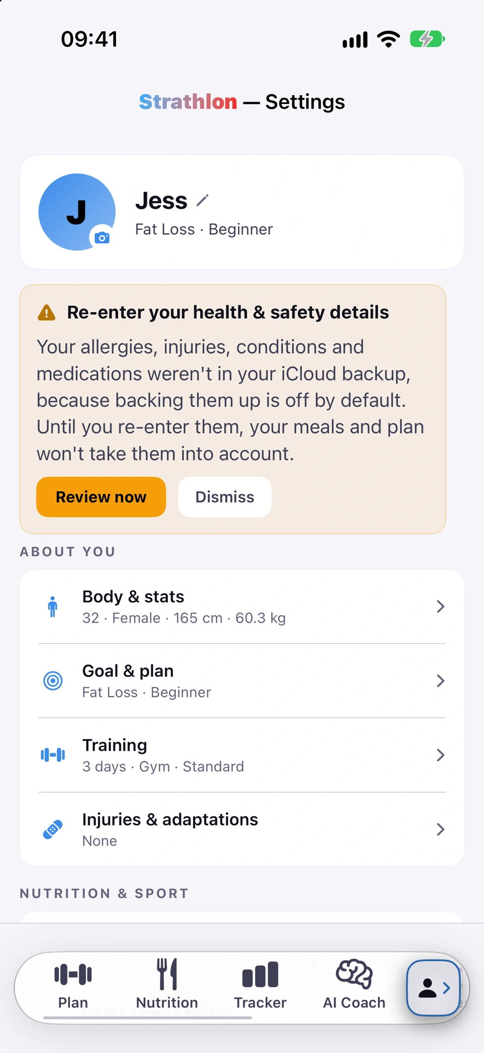 The top of Settings after a restore: an amber Re-enter your health & safety details card explaining they were not in the iCloud backup and your meals and plan won't take them into account until you re-enter them, with Review now and Dismiss buttons.